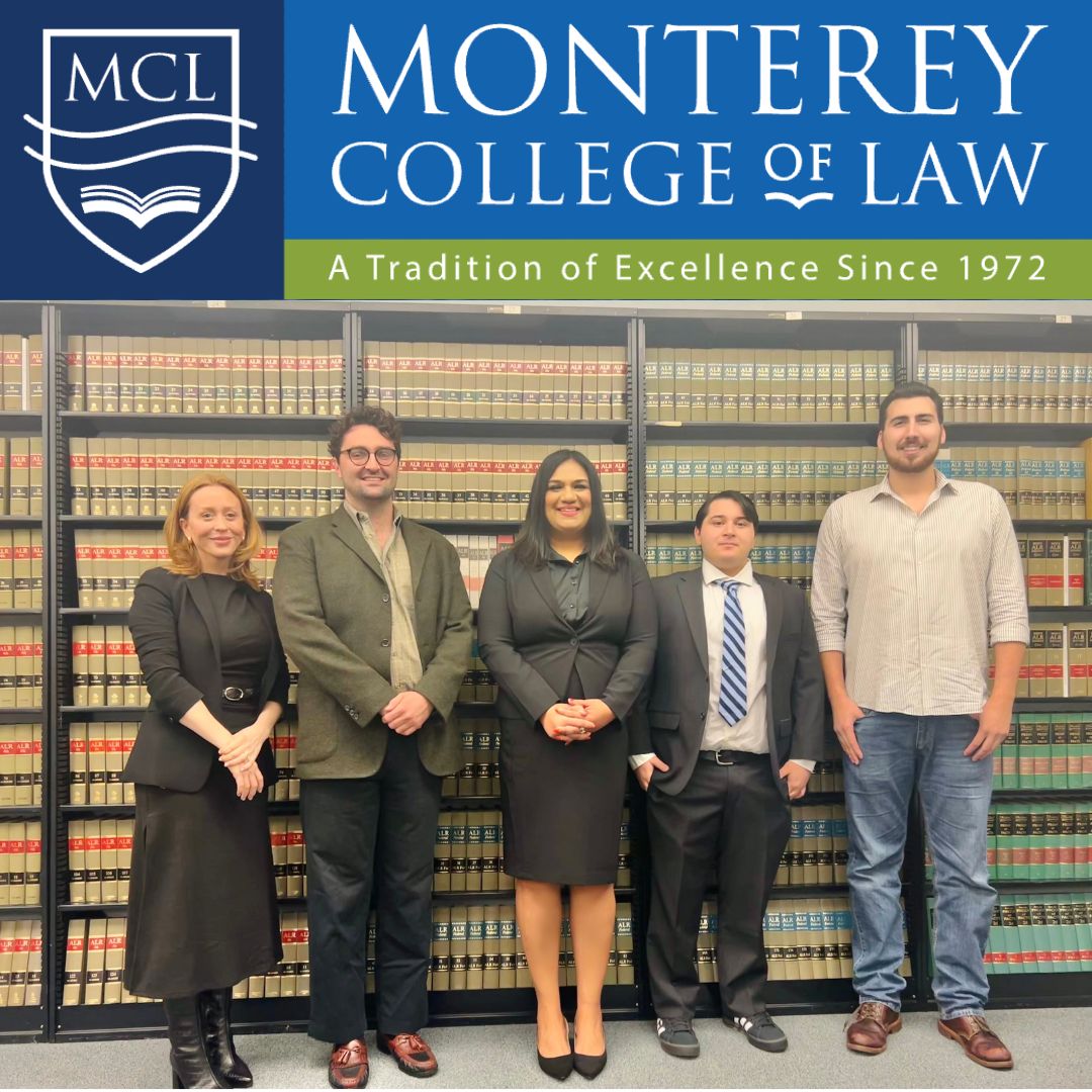 Picture of the MCL Student Bar Association Board Members in front of law books